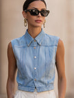 FJØRNA women's sleeveless denim vest with button-down front in light wash, casual sleeveless top for women.