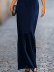 FJØRNA relaxed batwing sleeve fluid column maxi dress in light fabric, featuring a flowing silhouette and elegant design.