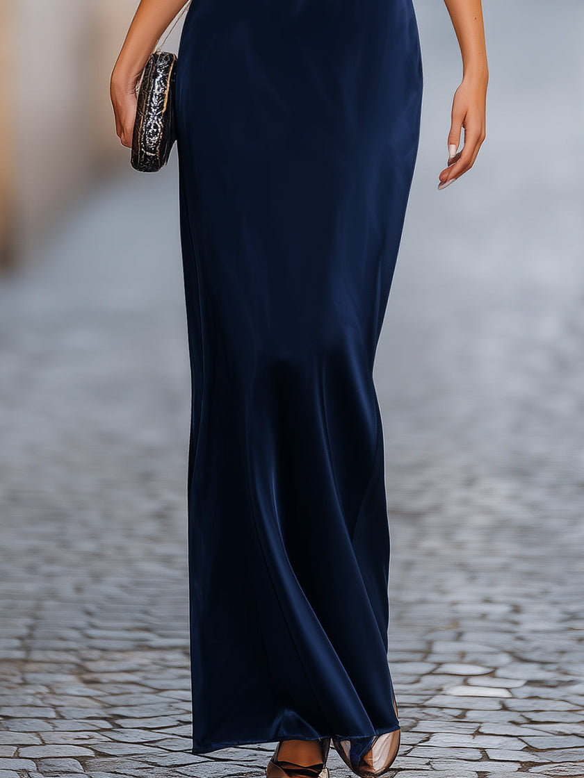 FJØRNA relaxed batwing sleeve fluid column maxi dress in light fabric, featuring a flowing silhouette and elegant design.