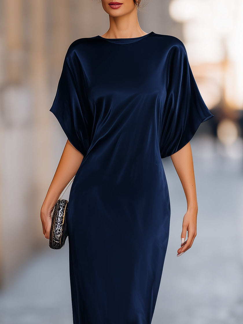 FJØRNA relaxed batwing sleeve fluid column maxi dress in soft fabric, featuring a flowing silhouette and elegant design.