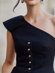 FJØRNA asymmetric one-shoulder buttoned peplum structured top for women, featuring a stylish design and tailored fit.