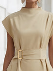 Beige sleeveless women's top by FJØRNA featuring a high neck, tie waist design, and gold belt buckle detail.