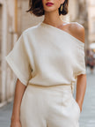 Ivory FJØRNA women's one-shoulder top with draped, relaxed fit and asymmetric design, perfect for stylish casual wear.