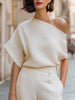 Ivory FJØRNA women's one-shoulder top with draped, relaxed fit and asymmetric design, perfect for stylish casual wear.