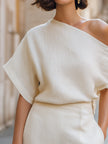Ivory women's one-shoulder top by FJØRNA featuring draped, relaxed fit with asymmetric design, stylish and comfortable for casual wear.