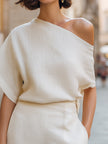 Ivory women's one-shoulder top by FJØRNA featuring a draped, relaxed fit with an asymmetric design.