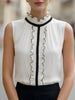 Ivory chiffon sleeveless blouse for women with ruffle high neck and black contrast trim, stylish FJØRNA tops.
