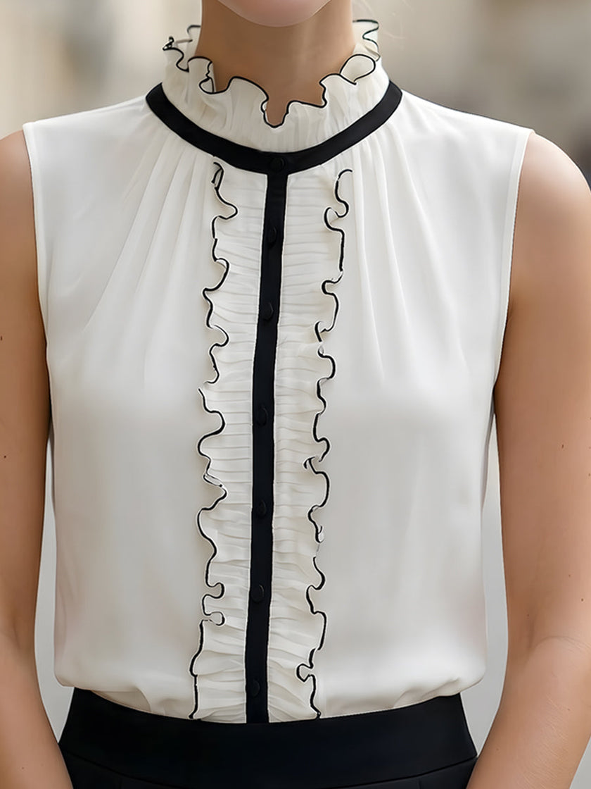 Ivory chiffon sleeveless blouse for women with ruffle high neck and black contrast trim, by FJØRNA.