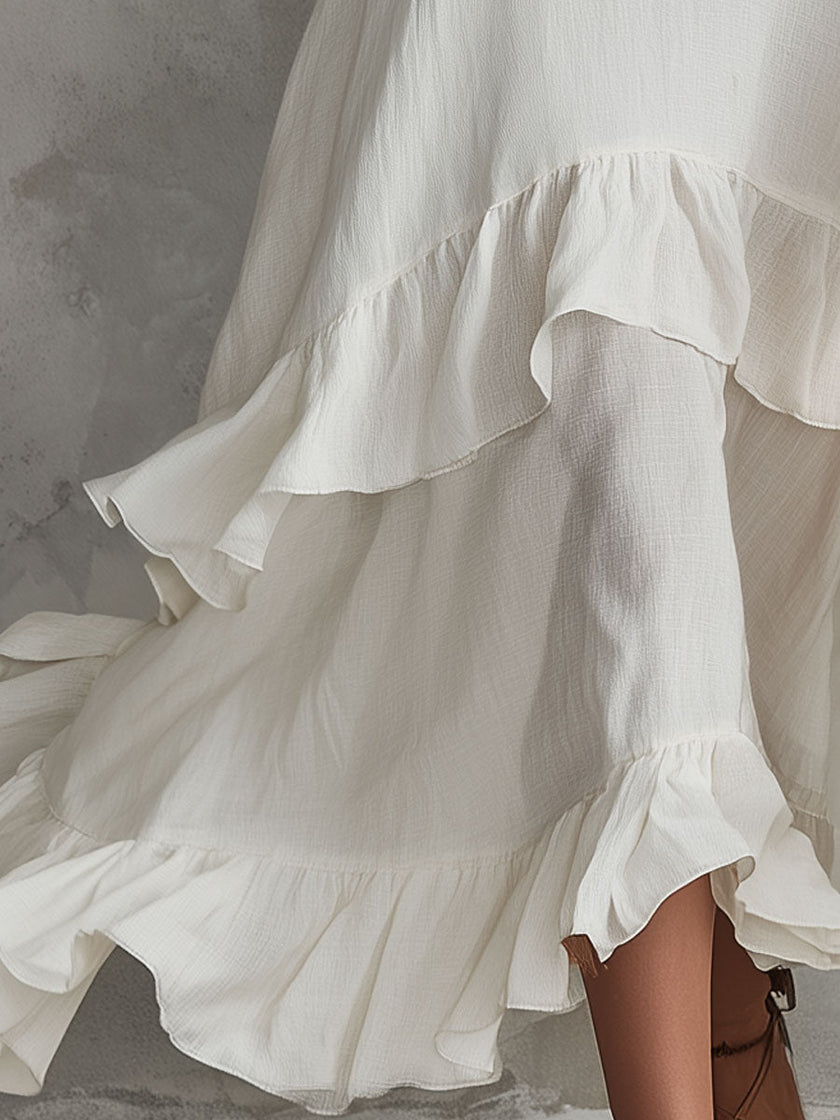 White sleeveless ruffled cotton-linen midi dress by FJØRNA, featuring a retro-elegant design perfect for warm weather.