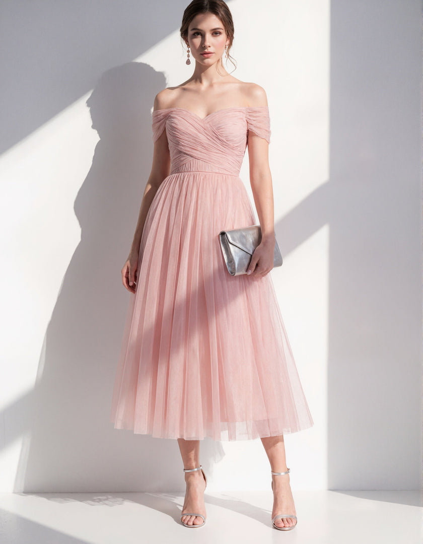 Pink tulle midi dress for women by FJØRNA, featuring a flowing silhouette and elegant design, perfect for special occasions.