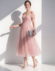 Pink tulle midi dress for women by FJØRNA, featuring a flowy design with delicate tulle fabric and elegant silhouette.