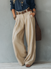 FJØRNA women's linen summer trousers with belt, lightweight and breathable for vacation and warm weather wear.