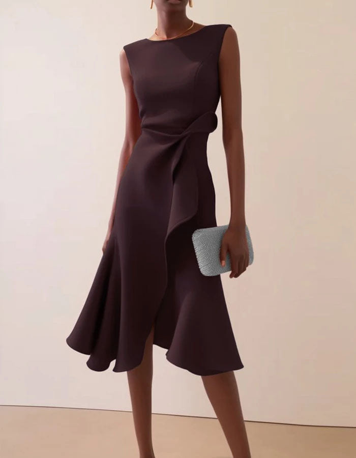 Pink FJØRNA midi dress for women with a round neck, sleeveless design, ruffle details, and bow accents.