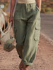 FJØRNA green multi-pocket cargo trousers for women, casual pants with multiple functional pockets and a relaxed fit.