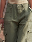 FJØRNA green multi-pocket cargo trousers for women, featuring multiple pockets and relaxed fit, casual outdoor style.
