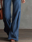 FJØRNA women's blue striped straight-leg jeans, casual pants with a classic fit and striped design, shown on a model.