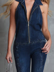 Dark blue denim flared jumpsuit for women by FJØRNA, featuring long sleeves and a fitted waist.