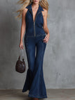 Dark blue denim flared jumpsuit for women by FJØRNA, showing a stylish full-length view with flared pant legs.