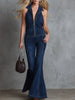Dark blue denim flared jumpsuit for women by FJØRNA, showing a stylish full-length view with flared pant legs.