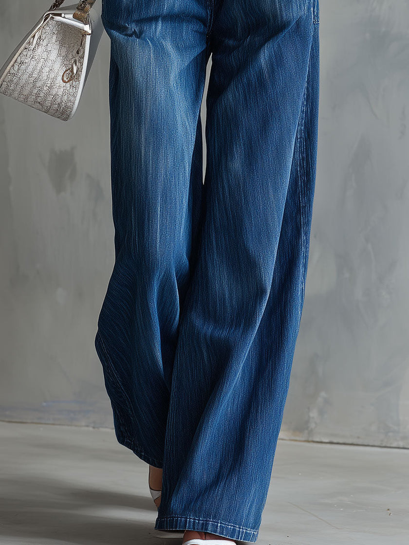 Blue washed denim sleeveless jumpsuit with collar for women, from FJØRNA, featuring a casual, stylish design.