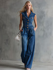 Blue washed denim sleeveless jumpsuit with collar for women by FJØRNA, shown on a model with front view.