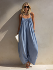 FJØRNA women's loose-fit sleeveless jumpsuit with square neck, gathered bodice, and wide-leg pants, casual and stylish.