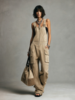 FJØRNA women's faux suede straight-leg overalls with zip front and multiple pockets, showing the stylish pants on a model.