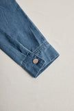 FJØRNA casual loose retro denim jumpsuit with long sleeves, hood, zipper, and front pockets, styled for a relaxed look.
