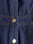 Dark blue denim FJØRNA jumpsuit with multi-pocket design, sleeveless balloon style, featuring a relaxed fit and casual, stylish look.