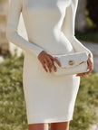 FJØRNA ribbed knit mini dress with turtleneck, perfect for wedding or casual occasions, in a fitted, stylish design.