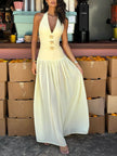 FJØRNA women's backless maxi dress with halterneck, lace-up deep V-neck, and elegant design for stylish occasions.