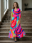 FJØRNA women's summer maxi dress with floral pattern, V-neck wrap style, flowing lightweight fabric, perfect for warm weather.