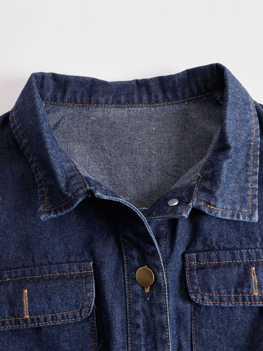 Dark blue denim FJØRNA jumpsuit with multi-pocket design, sleeveless balloon style, perfect for casual wear.