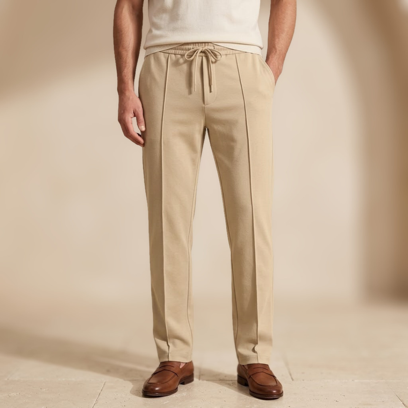 FJØRNA men's straight leg trousers with drawstring waistband, relaxed fit, lightweight fabric, and classic style.