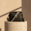 FJØRNA genuine leather crossbody bag with chevron strap, stylish women's bag featuring a sleek design and adjustable strap.