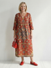 FJØRNA women's summer midi dress with long sleeves, wrap style, flowy fit, tailored design for a stylish, comfortable look.