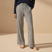 FJØRNA women's drawstring striped trousers with relaxed fit and side pockets, featuring a stylish casual design.