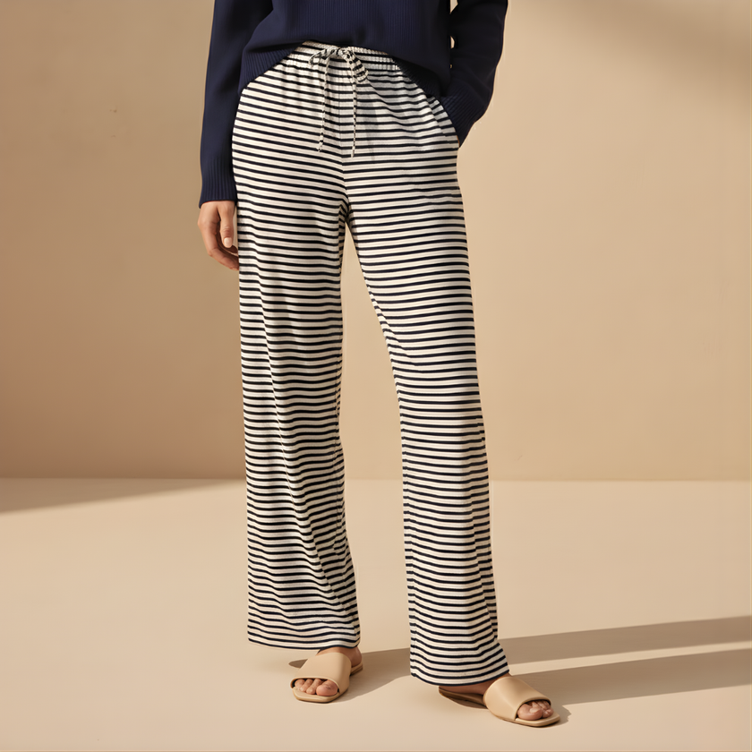 FJØRNA women's drawstring striped trousers with relaxed fit and side pockets, featuring a stylish casual design.