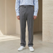 FJØRNA men's straight leg tailored trousers with a relaxed fit, shown in a neutral color on a model.