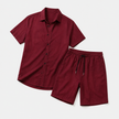FJØRNA men's linen two-piece set with buttoned short sleeve shirt and matching shorts, lightweight and casual for warm weather.