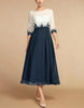 White chiffon midi dress for women with round neckline, stylish and elegant FJØRNA brand fashion.