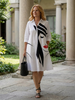 FJØRNA women's summer dress with colorful print and pockets, lightweight and casual for warm weather.