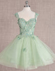 Mint green FJØRNA sleeveless tulle cocktail dress for women, featuring a fitted bodice and elegant skirt.