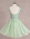 Mint green FJØRNA sleeveless tulle cocktail dress for women, featuring a fitted bodice and flared skirt.