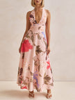 FJØRNA floral print halter backless tie-up women's maxi dress, flowing fabric with vibrant floral pattern and open back design.
