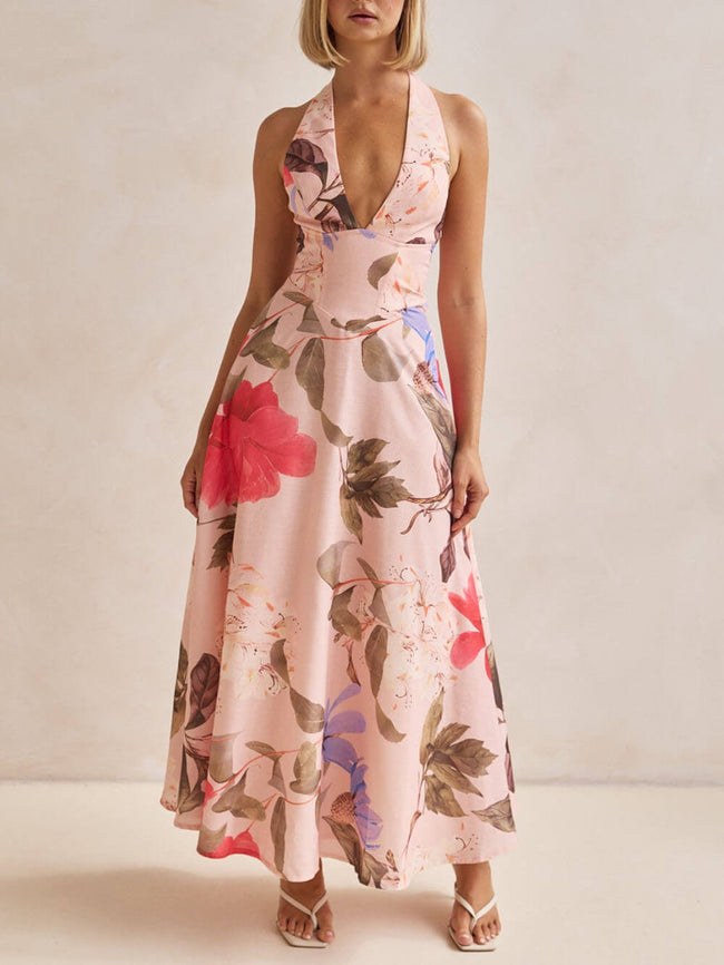 FJØRNA floral print halter backless tie-up women's maxi dress, flowing fabric with vibrant floral pattern and open back design.