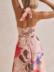 FJØRNA floral print halter backless tie-up women's maxi dress displayed with a flowing silhouette and vibrant floral pattern.