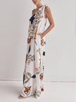 FJØRNA women's maxi dress with unique print, one-shoulder design, tie-up detail, and pockets, loose fit for casual wear.
