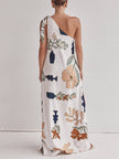 FJØRNA women's maxi dress with unique print, one-shoulder design, tie-up detail, and side pockets, loose and stylish.