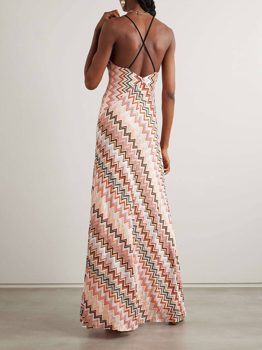 Elegant crochet printed open-back women's maxi dress from FJØRNA, featuring a summery design and flowing silhouette.